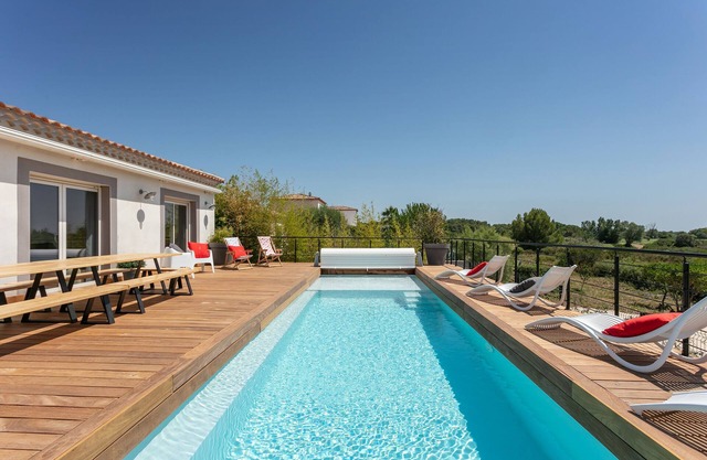 villa with pool facing Saint Thomas golf course