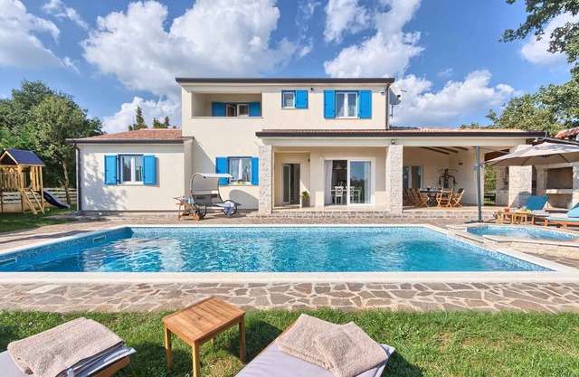 Villa with swimming pool, sauna and playground
