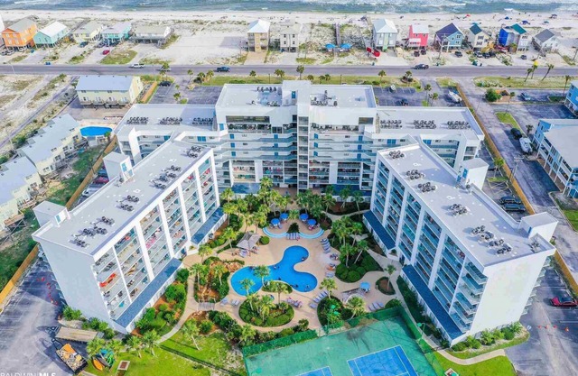 Waterfront condo with balcony. Pool, hot tub, tennis, beach access.