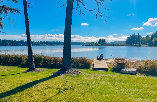 Waterfront home with beach access, firepit, fireplace, water views, grill, dock