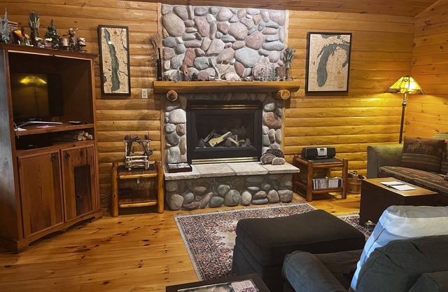 Waterfront log home on Lake Bellaire. Pet friendly. Fireplace, dock. Dog ok