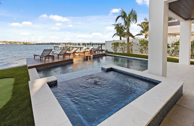 Waterfront Luxury Home with Pool and Spa, Golf Cart, and beach Bikes included!