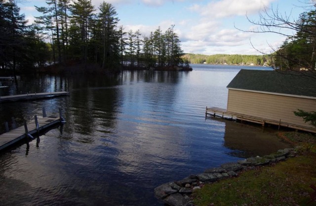 Waterfront property on pond with private dock .