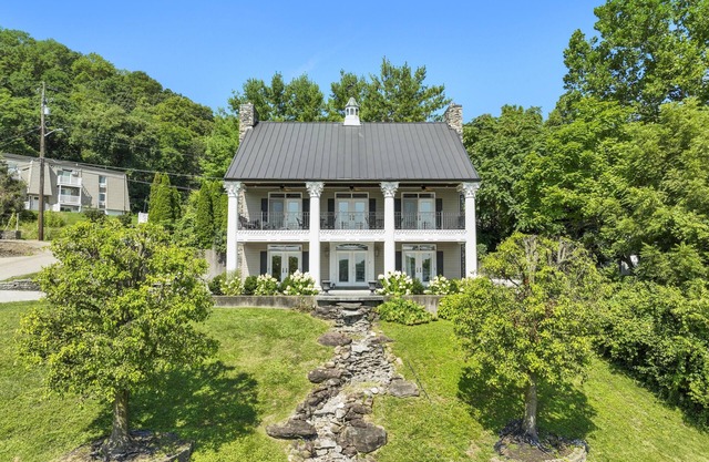 Welcome to the Banks of Aurora - A Charming River View Home in Downtown Aurora