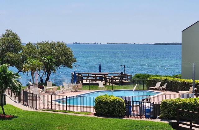 Welcome to the island lifestyle ! Gorgeous 2 BR, 1st floor, waterfront condo