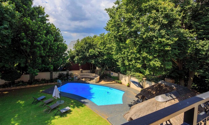 Northcliff Apartment | 11 Hotel Suites in Northcliff with AC, Wi-Fi, swimming pool & free breakfast.