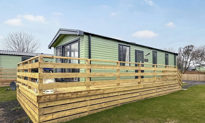 Castle Douglas House | 12ft-wide caravan situated in a coastal position.