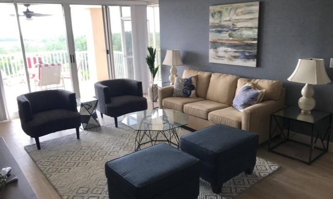 Pelican Bay Condo | 5 min walk to private beach with access to restaurant, bar and beach chairs.