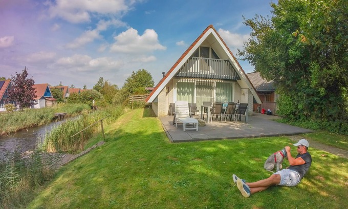 Anjum House | 6 Pers - Holiday home with sunny terrace by a typical Dutch canal