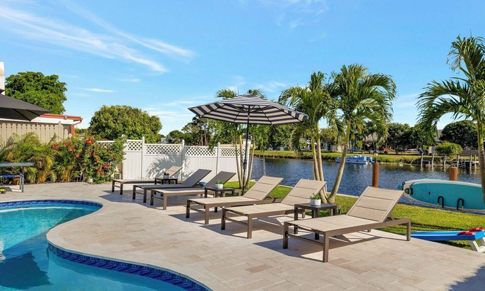 Tropic Palms House | 796 Serene 4BR Villa: Heated Pool, Tiki Hut & Waterfront Views in Delray Beach!