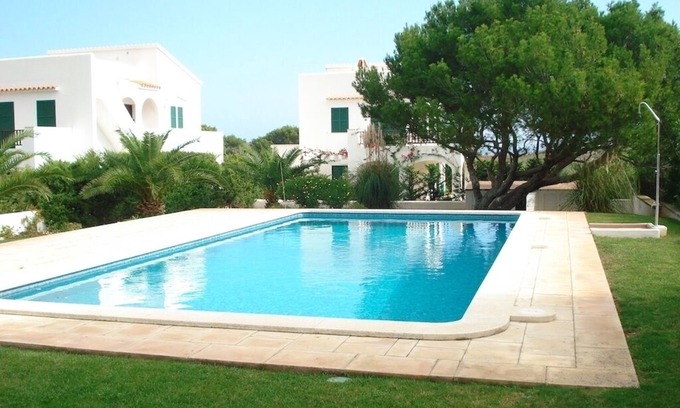 Arenal d'en Castell Ski Chalet | A stylish villa on the beach, with garden, pool and WIFI . pure rest