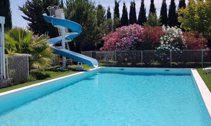 Milhaud Ski Chalet | Air-conditioned 2-bedroom chalet with pool, slide, garden, games.
