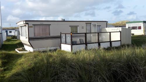Nes House | AMELAND-Nes-Duinoord: Stacaravan (chalet) + fietsen direct aan zee!