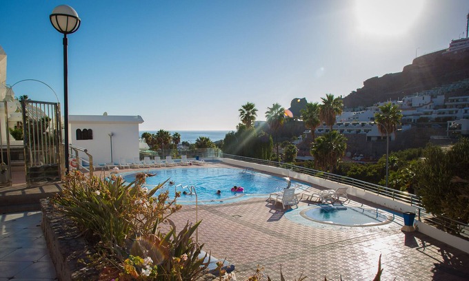 Puerto Rico Apartment | Apartamanto with terrace, free WiFi, communal pool in Puerto Rico
