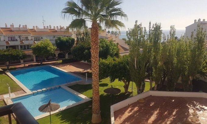 Coveta Fuma Apartment | Apt in lush gardens, large pool, steps from the sea, stroll to Campello beach