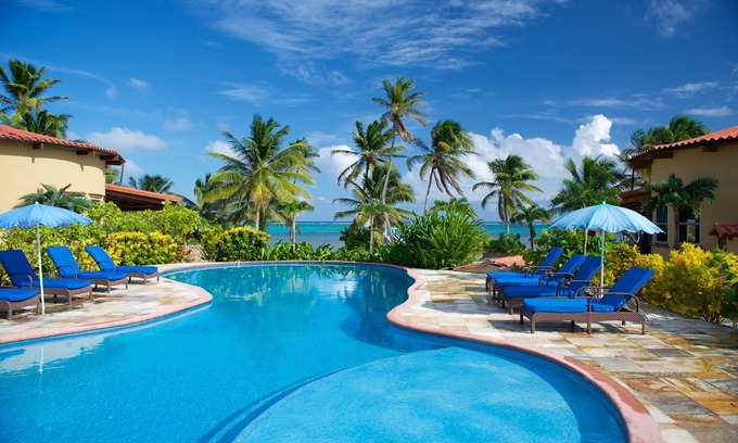 San Pedro Villa | Be right on the beach with a designer pool and your own tennis/pickleball court!