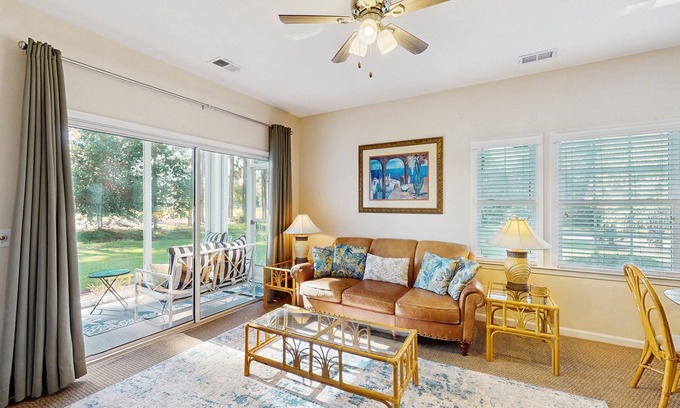 Sea Trail Condo | Beach-themed retreat with outdoor pool, gym, patio & AC - snowbird-friendly