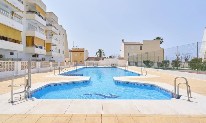 Caleta de Velez Apartment | Beachside Bliss Apartment with Shared Pool, Wi-Fi, and Air Conditioning