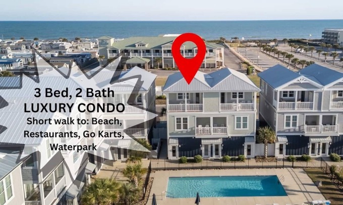 Emerald Isle Apartment | Beautiful beach views with top floor living area. Professionally decorated. Walkable to shops.