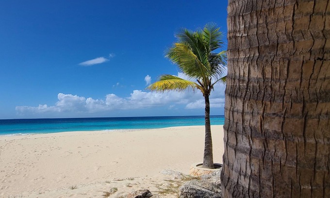 Long Bay Village House | Beautiful West End condo directly on Long Bay Beach