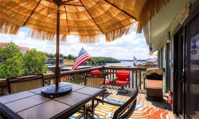 Lake Ozark Condo | BEAUTIFULLY UPDATED LAKEFRONT CONDO & OVERSIZED DECK, WI-FI, 2 Pools, hot tub.