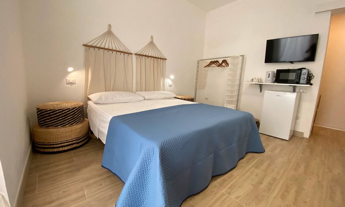 Sant'Isidoro Bed & Breakfast | Bed and Breakfast 'Isid'Oro Rooms - Camera 1' with Balcony, Wi-Fi and Air Conditioning