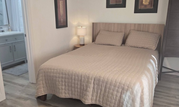 Rolando Park House | Bedroom with Private Bathroom and Queen Size Bed.