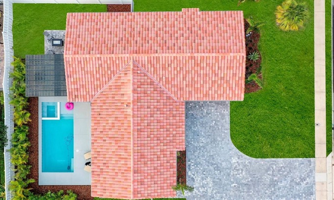 Venetian Way House | Bright and Beachy Pool Home