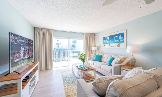 Banana River Estates Condo | Bright Oceanfront Cocoa Beach Condo with Heated Pool & Steps to the Pier!
