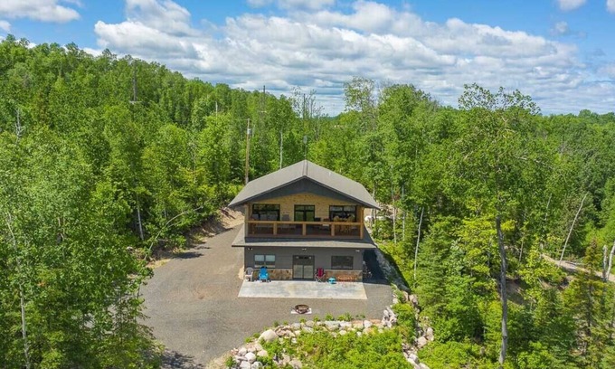 Tower Cabin | Cabin is nestled in the woods near Lake Vermilion, offering breathtaking views.