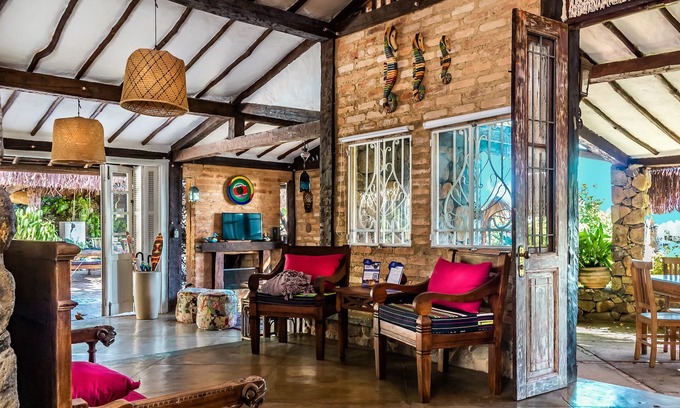 Armacao House | Casa caiçara com 5 suítes, piscina aquecida, sauna e vista para o mar