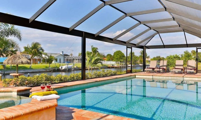 Cape Coral Villa | Casa Nueva Waterfront w/Heated Pool/Spa + Tiki