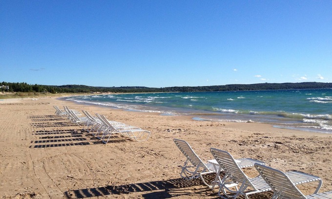 Menonaqua Beach Cottage | Charming Harbor Springs cottage right on the sandy beach and crystal water