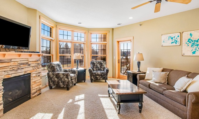 Three Lakes Condo | Charming lakefront condo with pool, fireplace, hot tub, golf, & washer/dryer