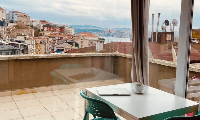 Cihangir Apartment | Charming terrace apartment in historic Istanbul with dreamy Bosphorus views.