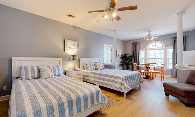 Sea Trail Apartment | Coastal Suite with golf course view and shared pool access