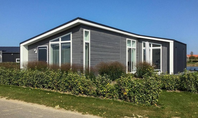 Wemeldinge House | Comfortable home with modern interior with view of the lake.