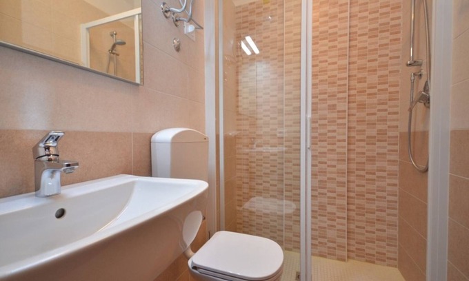 Lignano Riviera Apartment | Contemporary holiday apartment with shared swimming pool