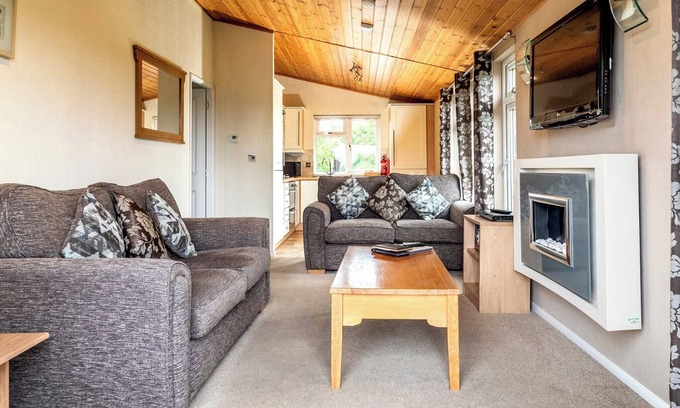 Diss Ski Chalet | Contemporary luxury lodge with luxurious king-size bed.