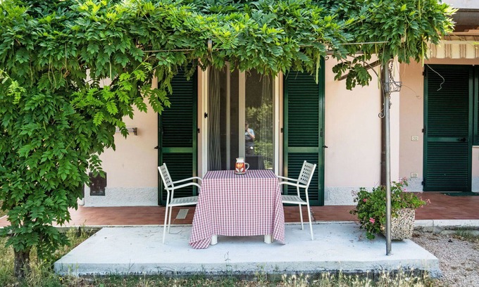 San Feliciano Apartment | Cosy apartment for 4 guests with A/C, pool, WIFI, TV, patio and pets allowed