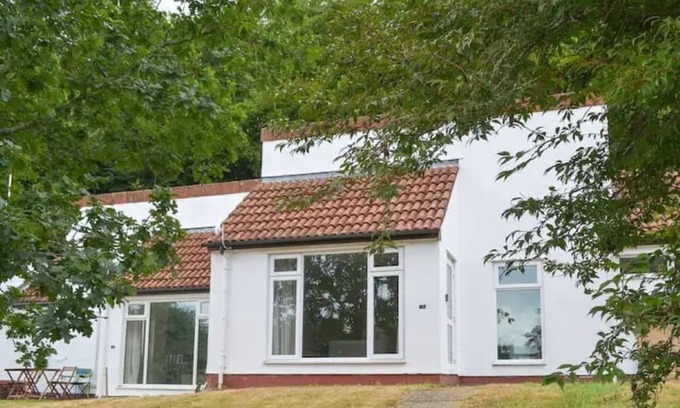 St. Ann's Chapel House | Cosy bungalow in Tamar Valley with shared pools, gym and beautiful scenic views.