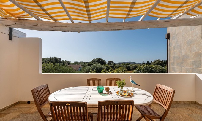 Chia House | Cosy Holiday Apartment "Villa Fico 2" with Balcony, Garden and Air Conditioning