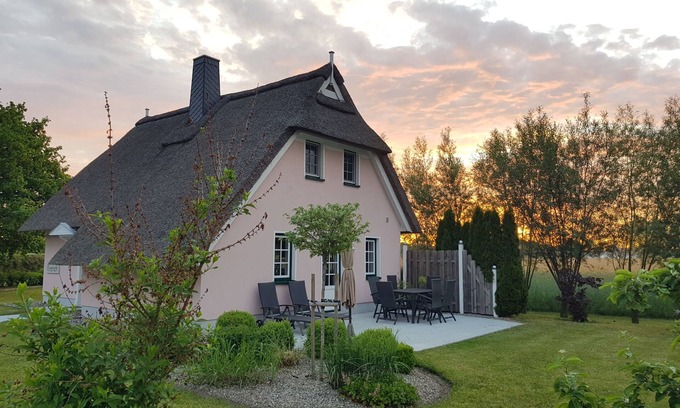 Rakow House | Coziness under thatch, fireplace, sun terrace