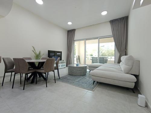 Dubai Investment Park Apartment | Cozy Bedroom Retreat in Green Community Pool View
