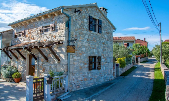Rakalj House | Cozy istrich stone house with fireplace and garden