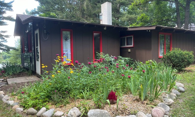 Lake Ann House | Cozy waterfront sunset cottage on Herendeene Lake in Lake Ann, Dock, Dog ok