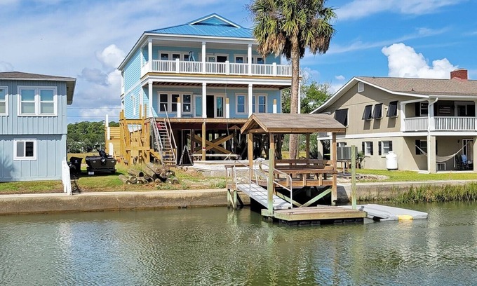 Pawleys Island House | Creek front beach house, elevator, saltwater pool, canal dock, dog friendly