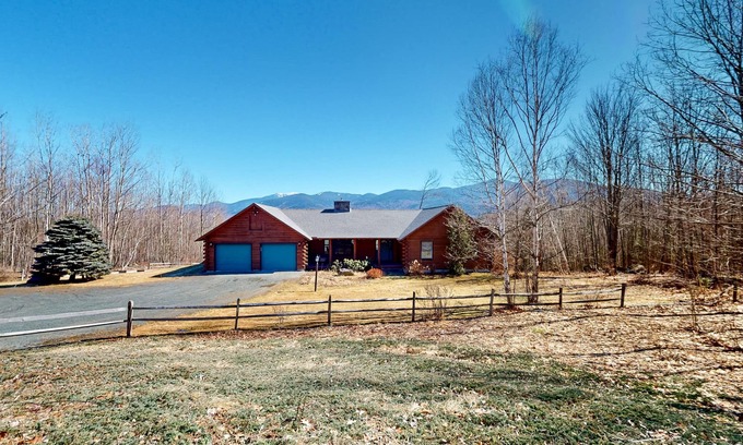 Easton House | Custom log home with wood stove, games, generous deck, & stunning mountain views