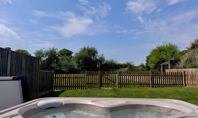 Dilham House | Dog and family friendly barn conversion with fully enclosed garden and hot tub