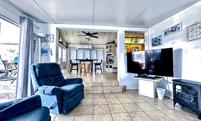 Port Isabel House | Dog-friendly bayfront home with in/outdoor pools, tennis, gym, W/D, bay views